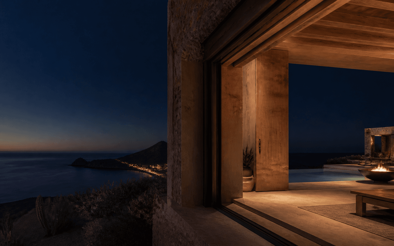 Blue-hour view across the Baja coast from a Trip & Homes residence